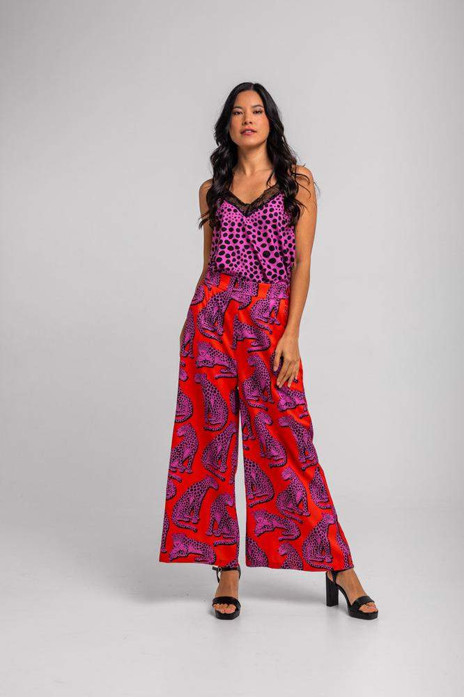 Pantalón fluido naranja y panteras rosas 
