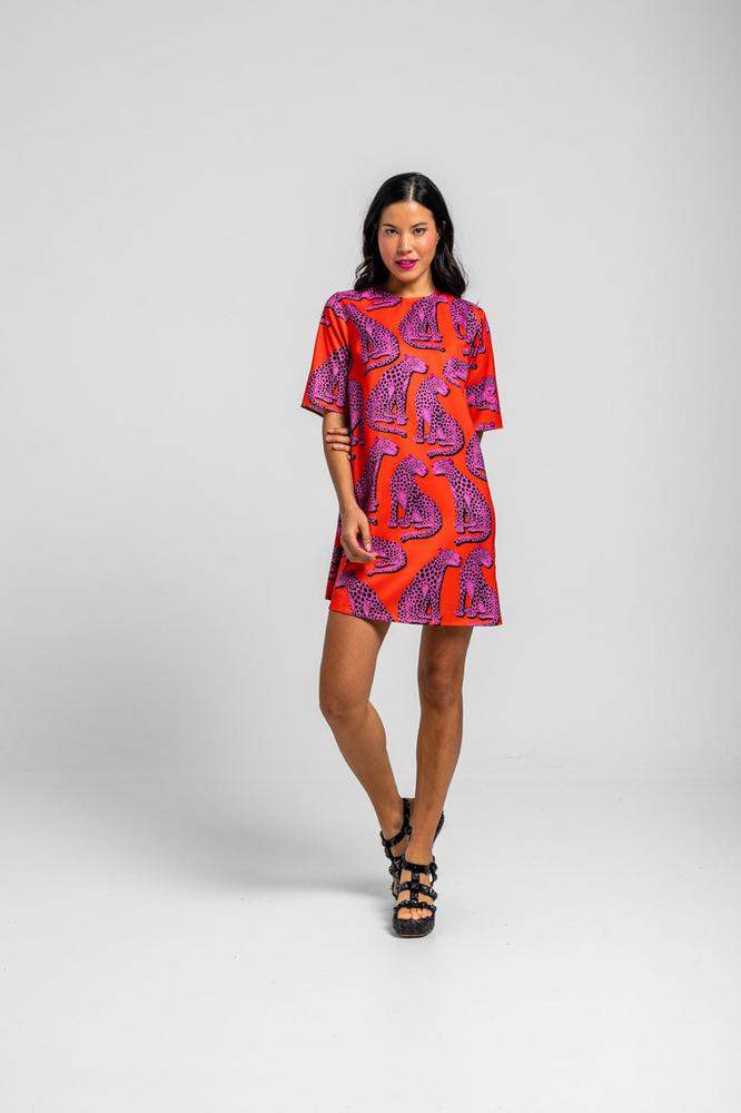 Vestido corte A corto naranja y panteras rosas 
